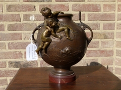 Belle epoque style bronze vase with putto,s on red marble base in patinated bronze, France 1890