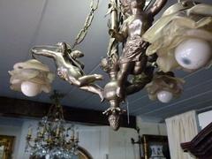 Louis 16 style Lamp with 3 putti,s in silver plated bronze, France 1910