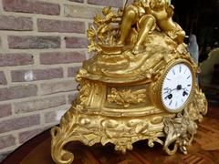 Louis Philippe style Gilded clock in bronze and spelter, France 1870