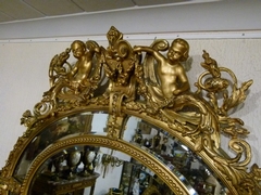 Napoleon III style Huge gilded oval mirror with putto,s, France 1880