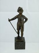 style Sculpture of a young smoking boy in bronze on marble base, France 1920