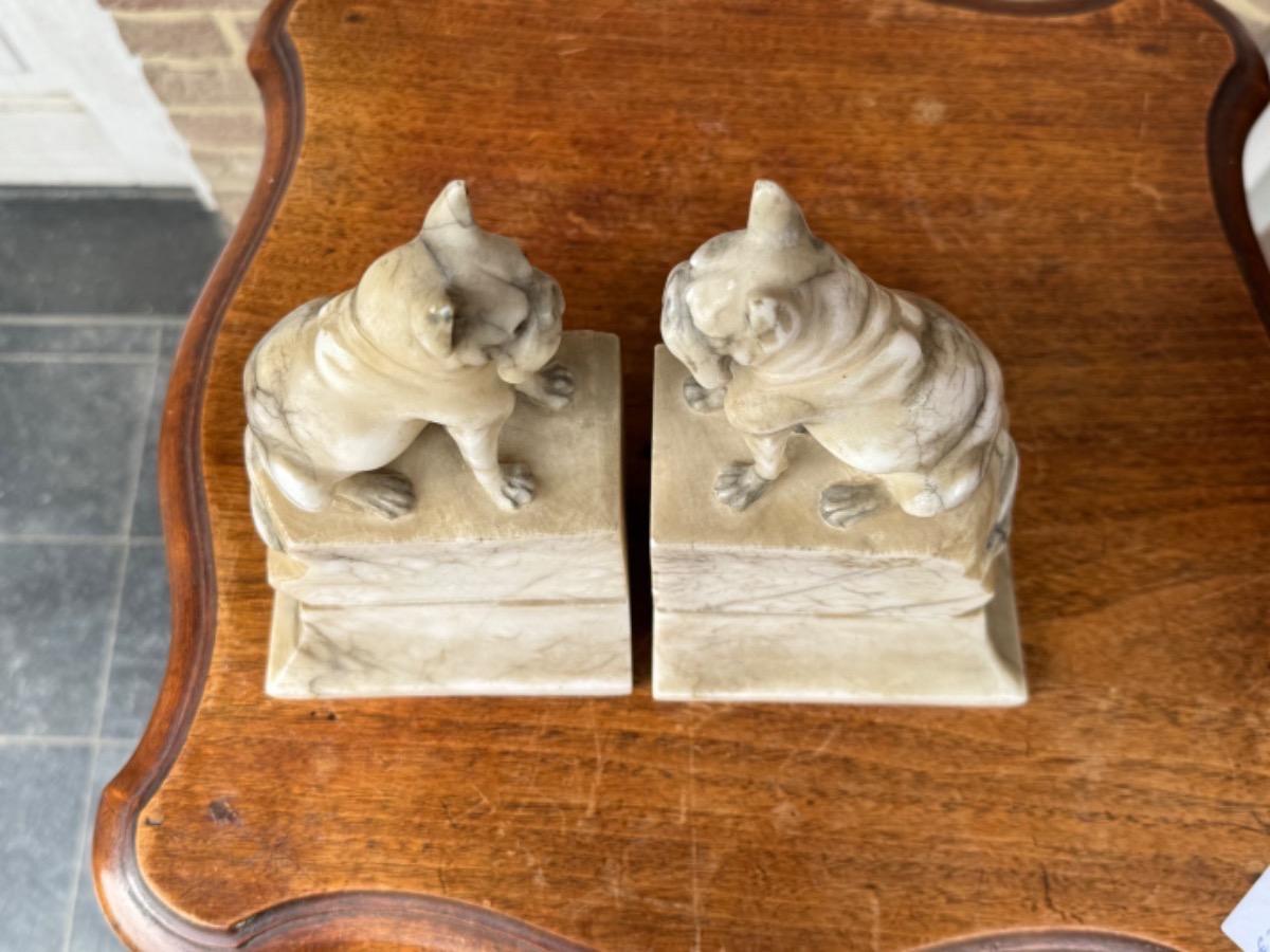 Alabaster book stands with dogs