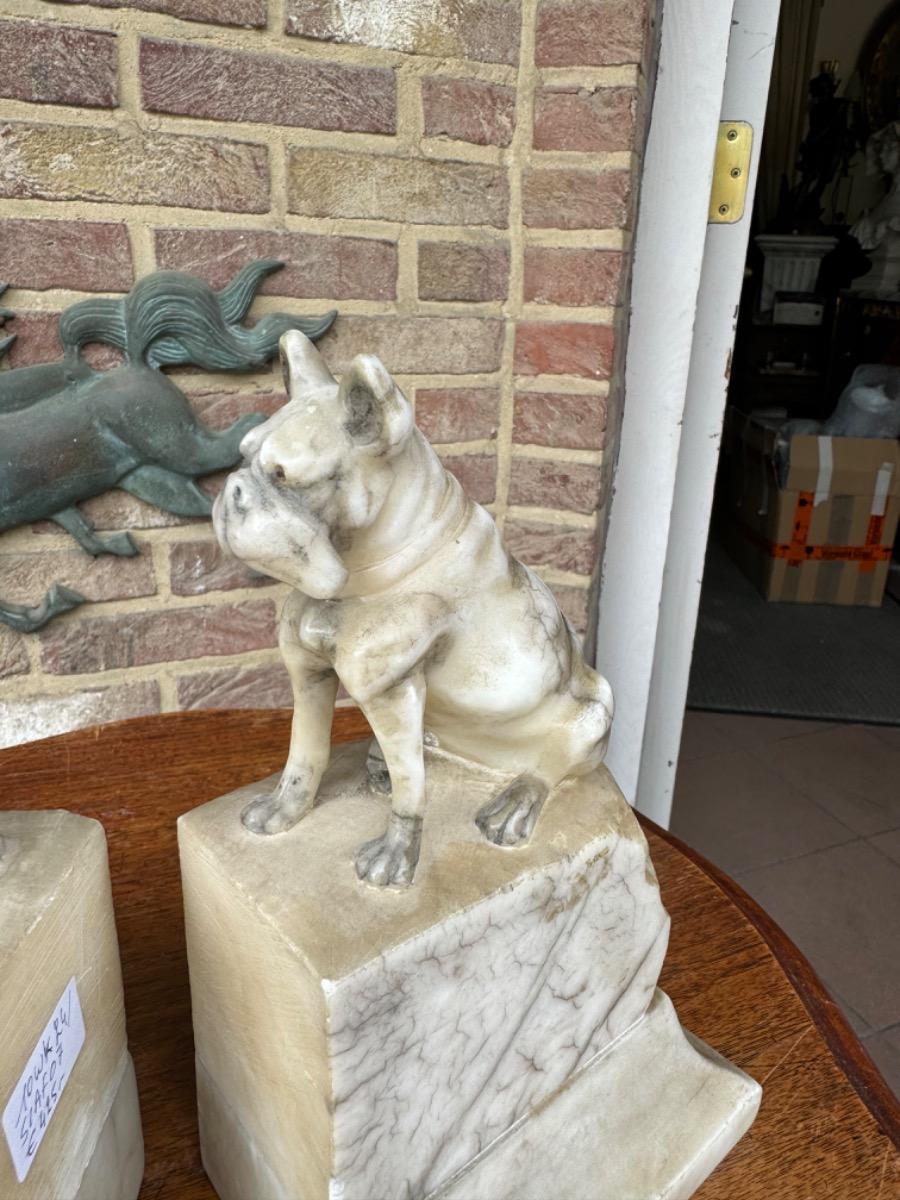 Alabaster book stands with dogs