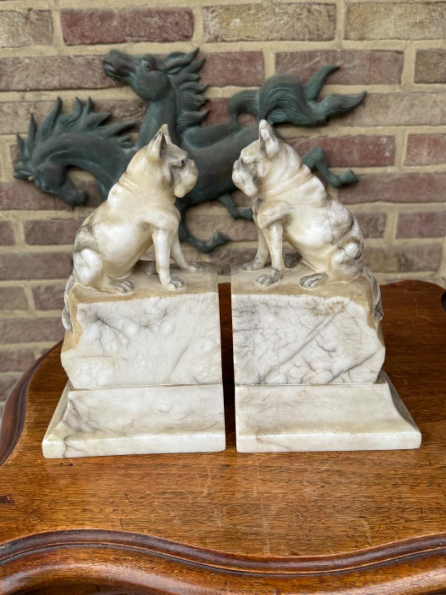 Alabaster book stands with dogs