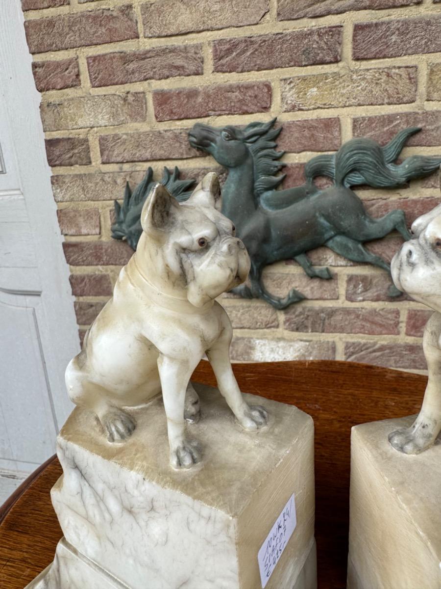 Alabaster book stands with dogs