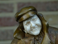 Belle epoque style Sculpture by H. Sécarel of a man with ivory face in multi color patinated bronze, France 1900