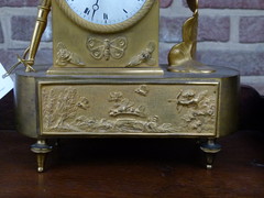 Empire style Gilded clock pendule with butterfly and child in bronze, France 1815