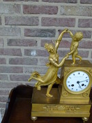 Empire style Miniature pendule clock with a lady and child in gilded bronze, France 1815