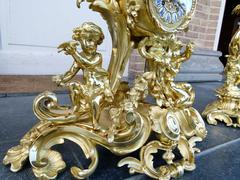 Louis 15 style Clockset with putti,s Napoleon 3  in gilded bronze, France 1880