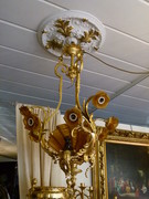 Louis 15 style Lamp with 3 putti,s and brown glass shapes in gilded and patinated bronze, Belgium 1920