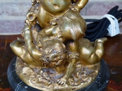 Napoleon III style Table lamp with 3 cherubs-putto,s in gilded bronze on marble base, France 1890