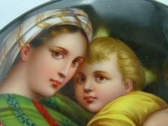 style painting on porcelain plate of a mother with child in porcelain 1880
