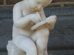 style Sculpture of a young boy write a book in carved alabaster, Italy 1900